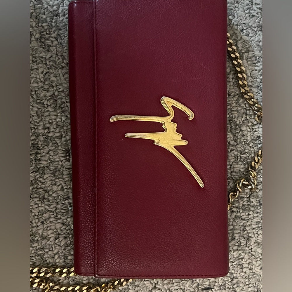 100% authentic Giuseppe red clutch bag!